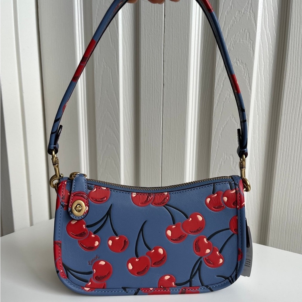 coach cherry swinger bag